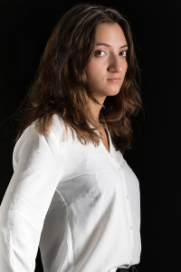 portret young female no smile in white shirt